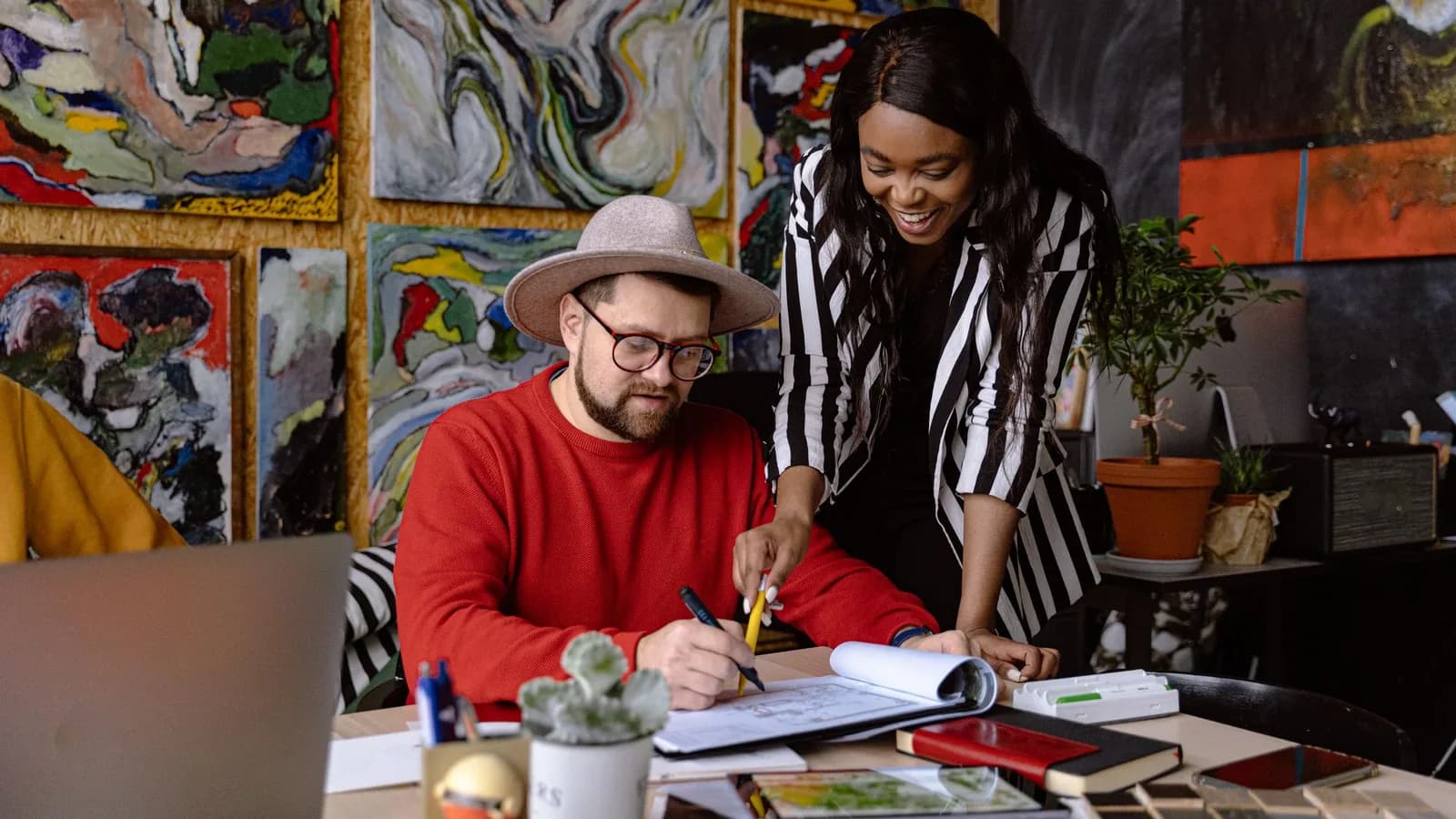 Two creative professionals collaborating on the same design project