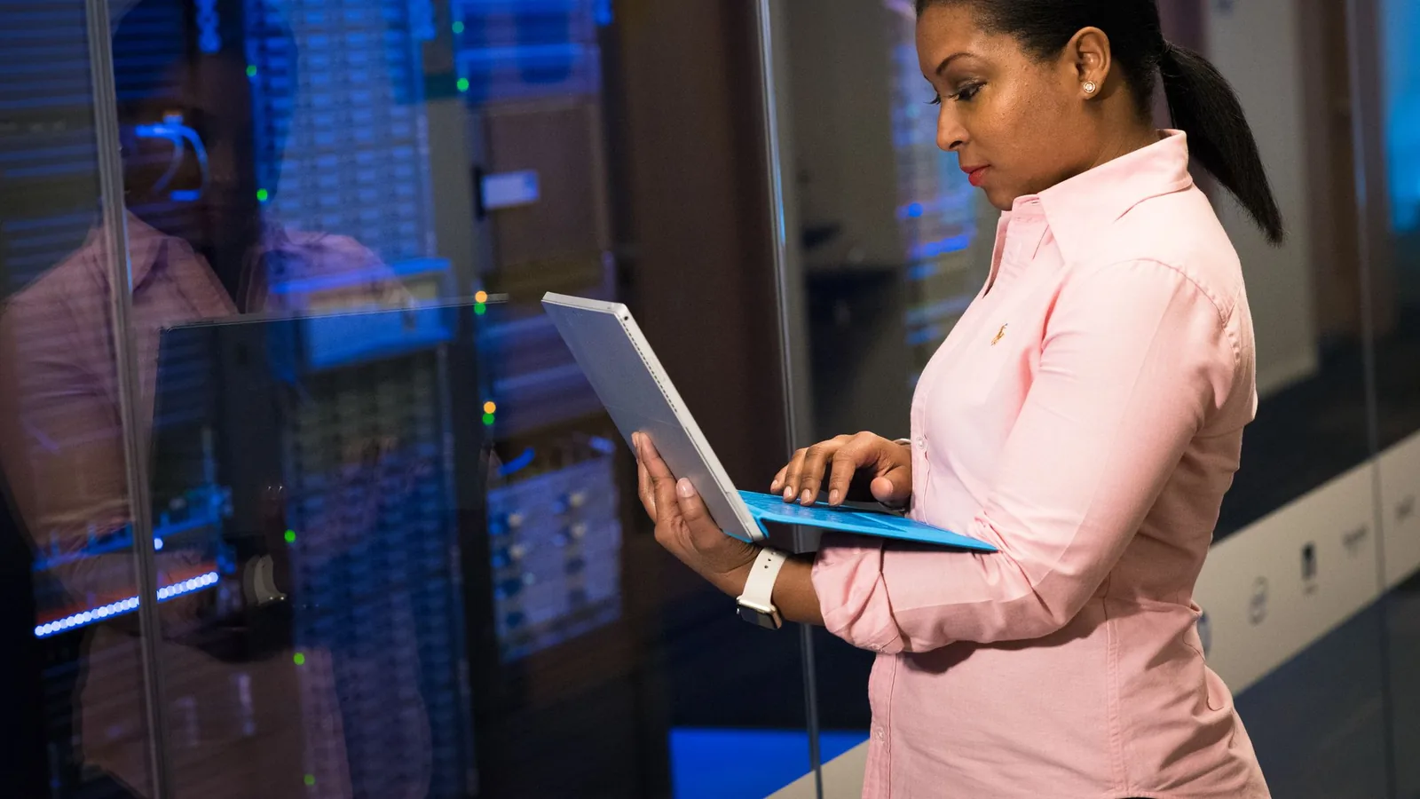 Technical specialist monitoring and maintaining digital systems
